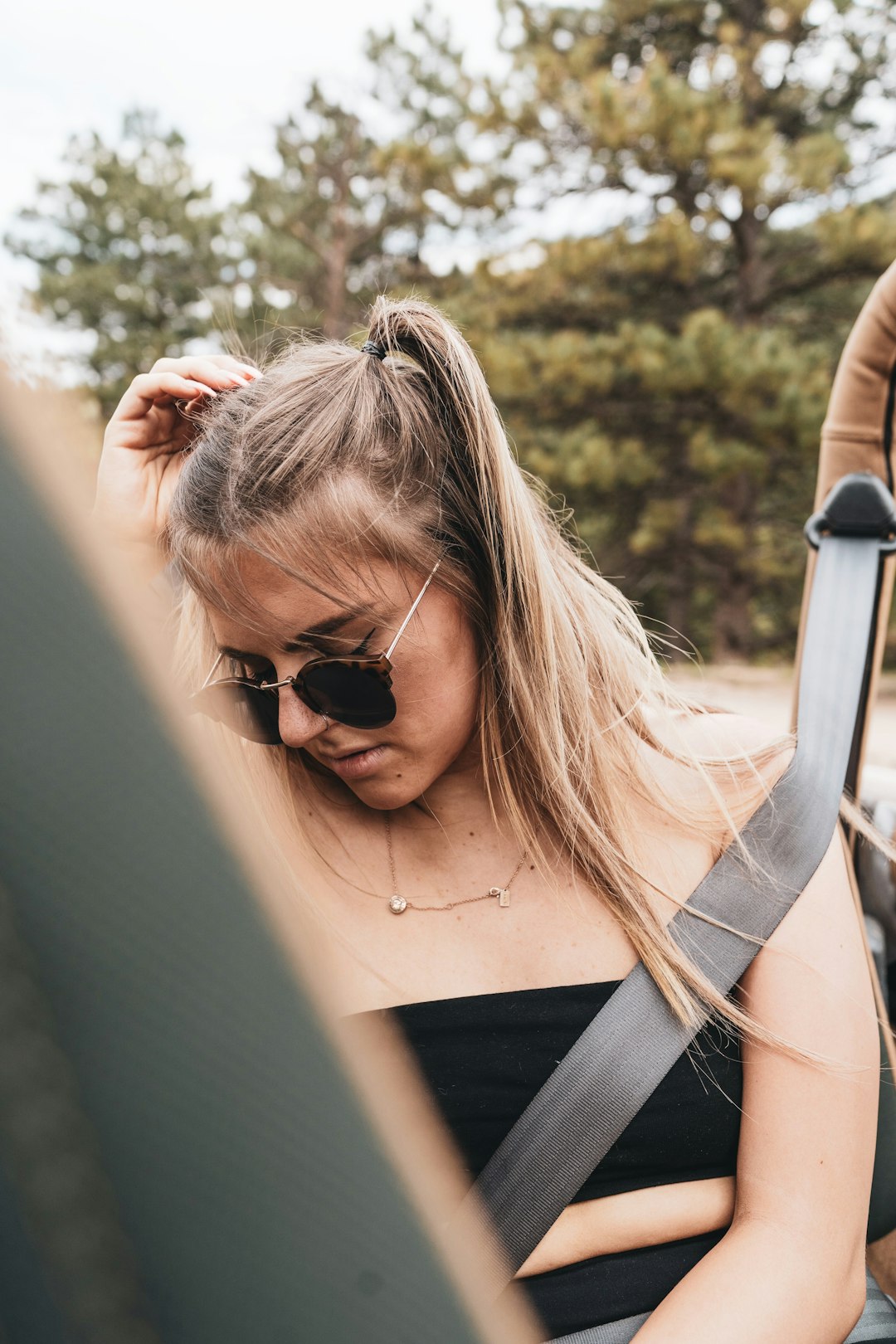 woman in black tank top wearing black sunglasses