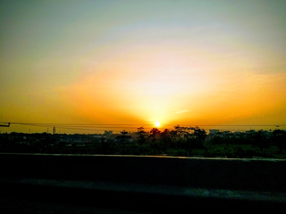 A scenic view of a travel destination with a golden sunset.