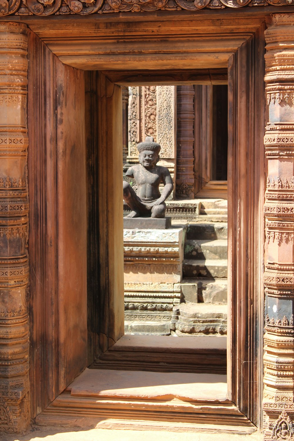 brown wooden door with gray stone