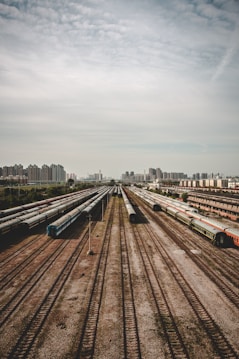 red and black train on rail road during daytime