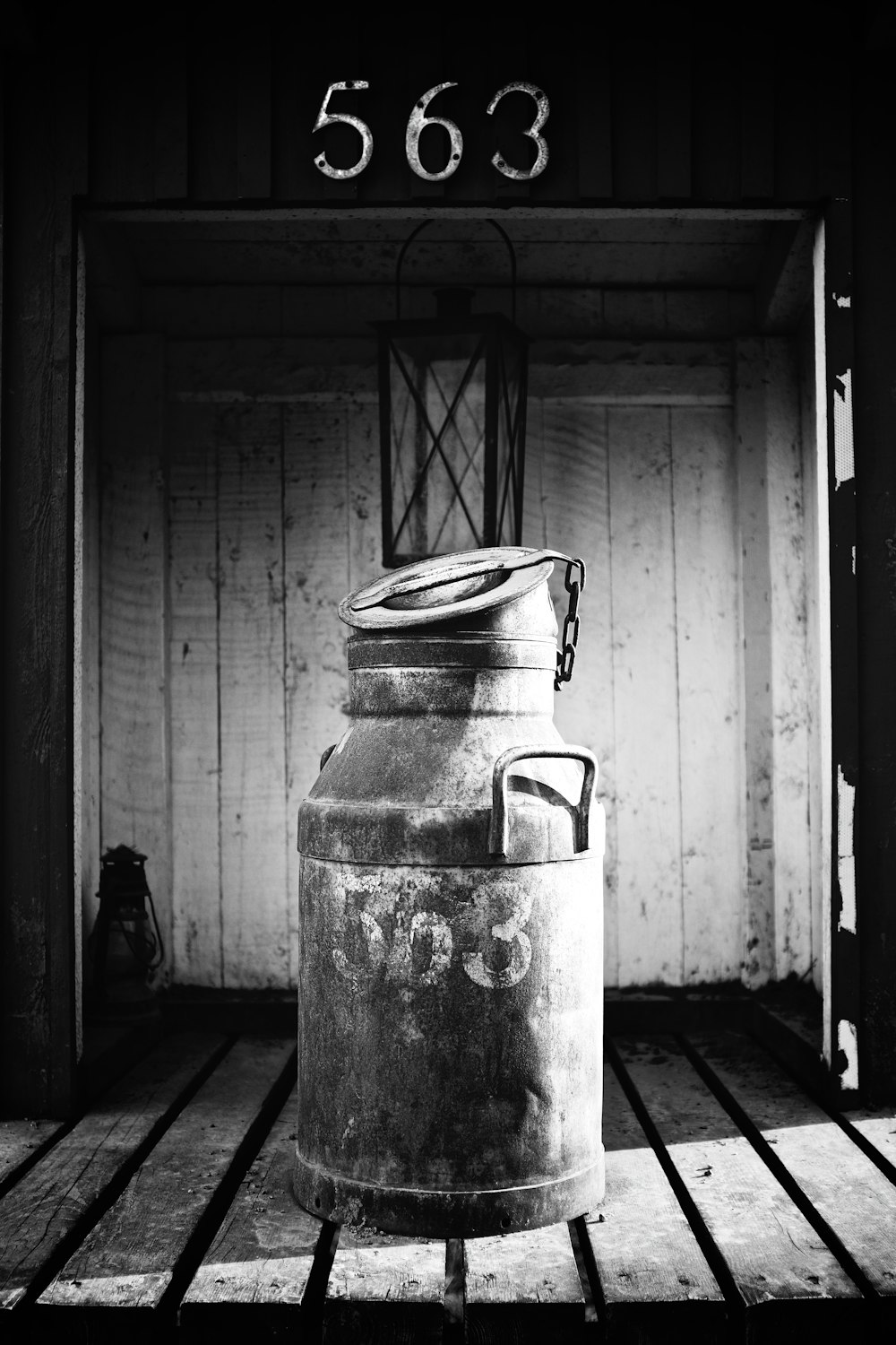 gray steel kettle on white steel container