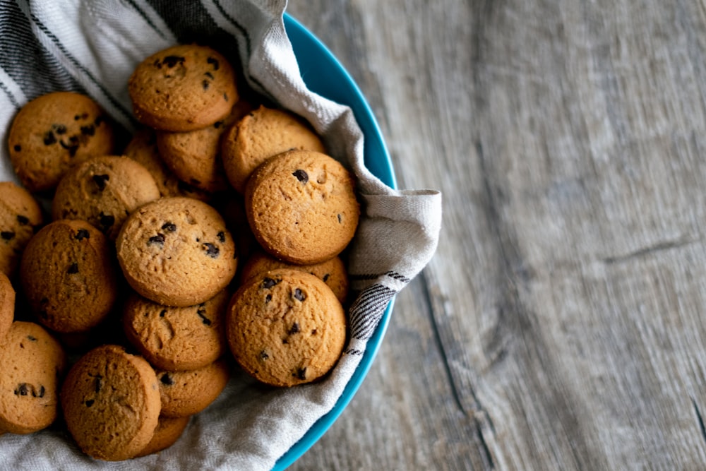 brown cookies in blue ceramic bowl