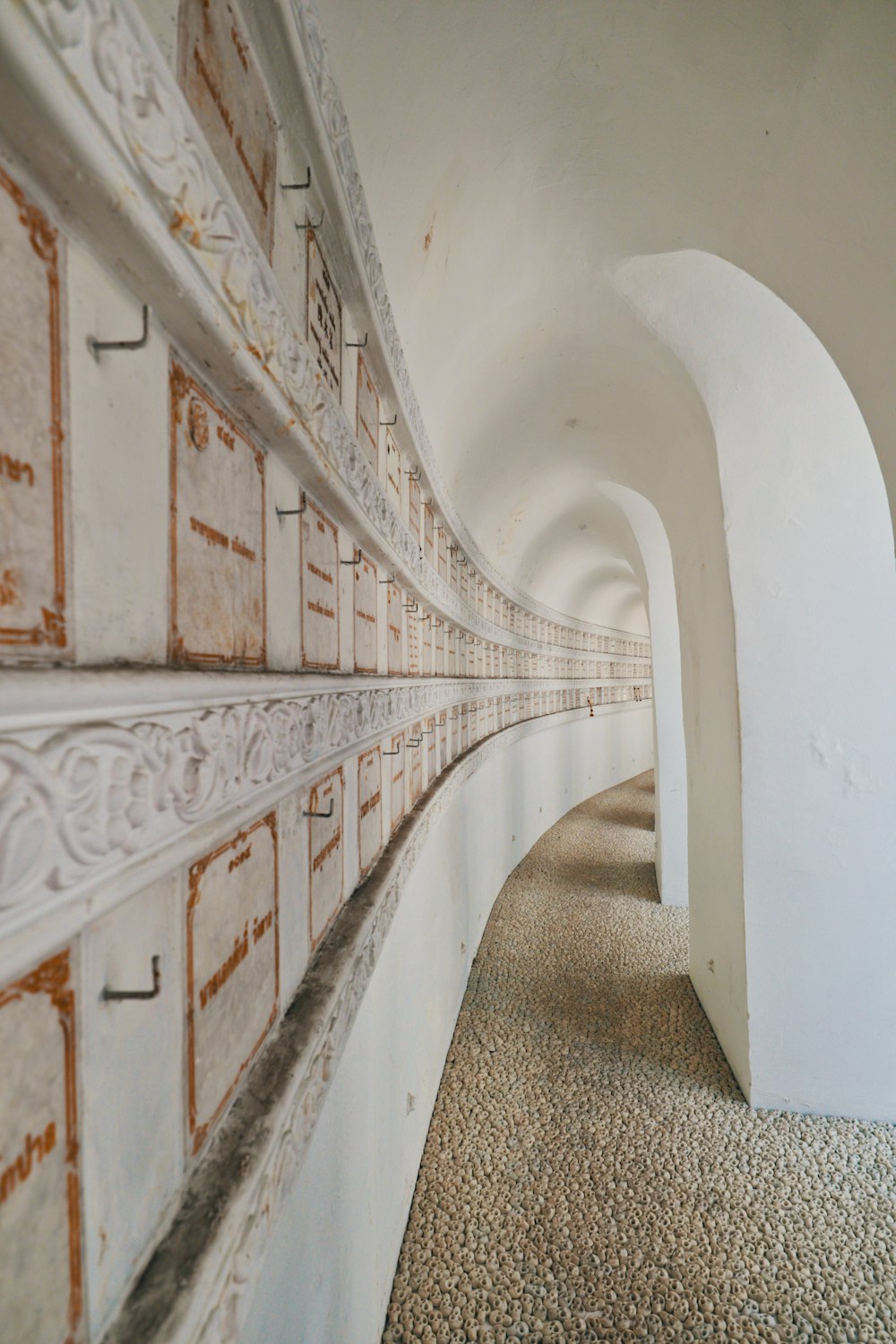 white and brown hallway with white walls