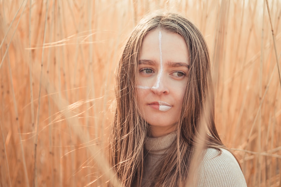 woman in gray turtleneck sweater smiling