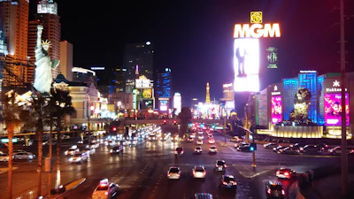 Nightlife in Shenzhen with glowing city lights and trendy rooftop bars filled with young travelers.