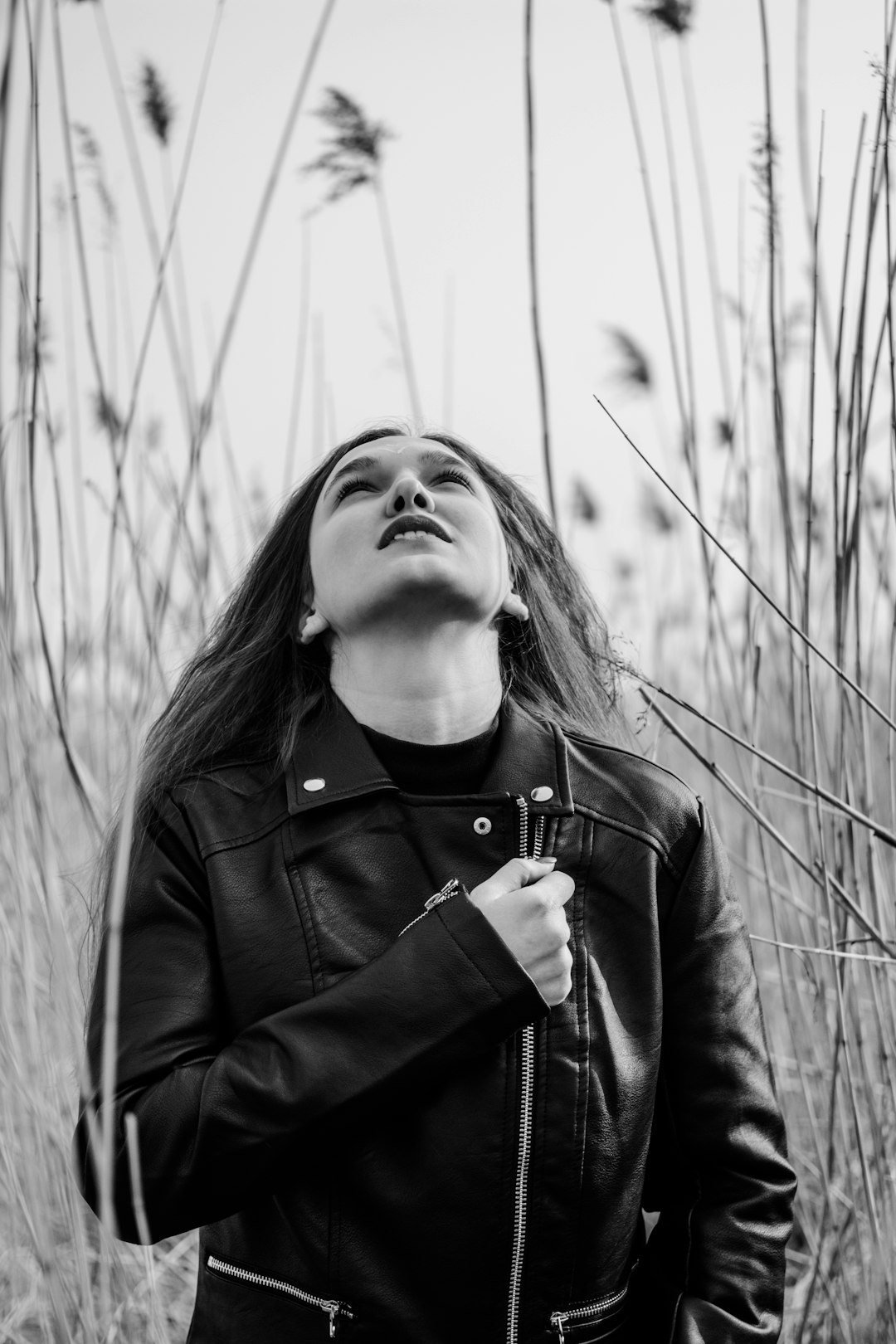 grayscale photo of woman in black jacket