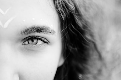 grayscale photo of womans face