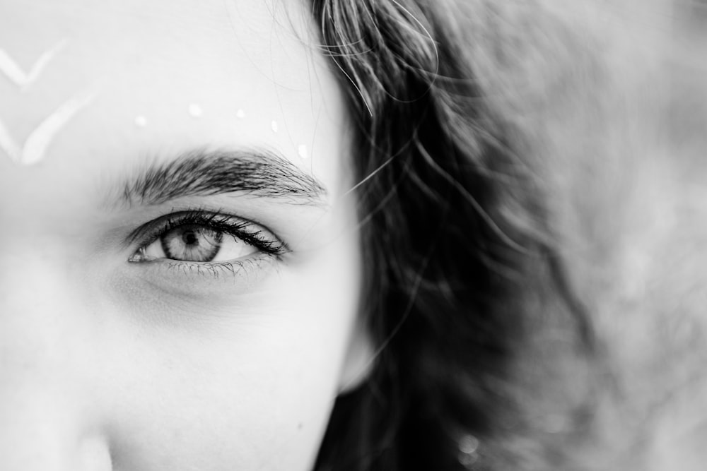 grayscale photo of womans face