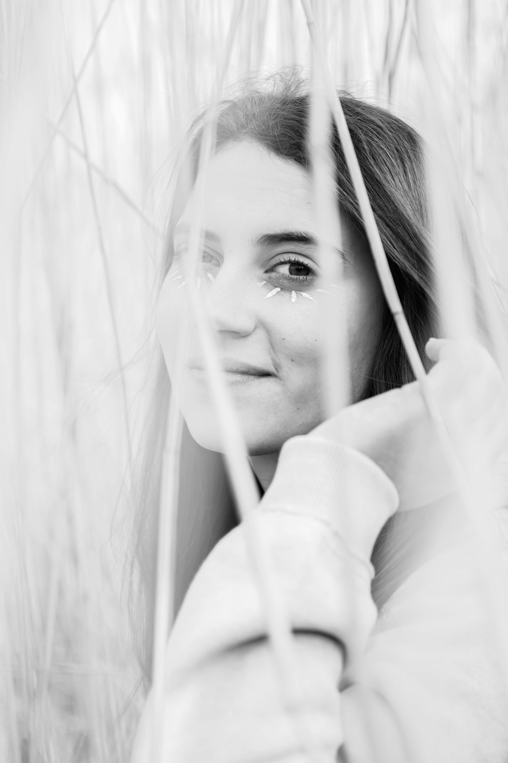 grayscale photo of woman in white long sleeve shirt