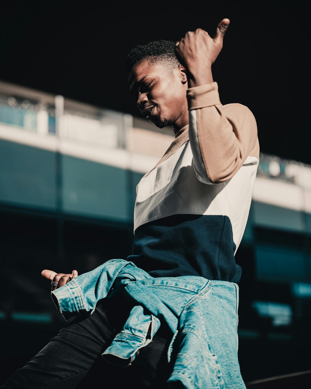 man in blue denim jeans and white shirt