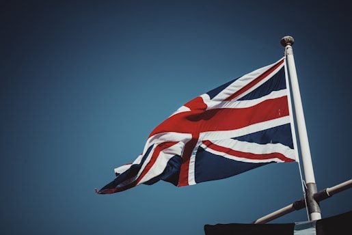 A website header featuring a British flag icon for English language selection.