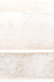 Close-up of finely cut stone steps leading to a charming front porch.