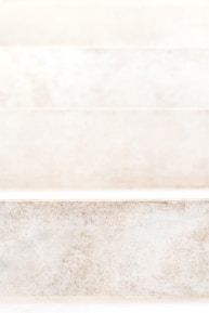 Close-up of a freshly installed custom stone step with intricate detailing.