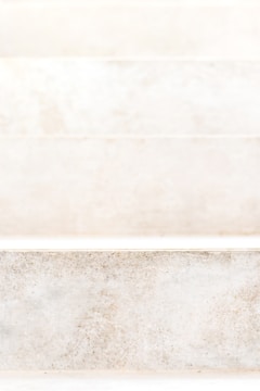 Close-up of finely cut stone steps leading to a charming front porch.