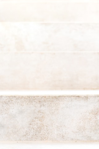 Close-up of a freshly installed custom stone step with intricate detailing.