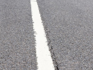 Close-up of freshly paved residential driveway with clean edges and smooth asphalt.