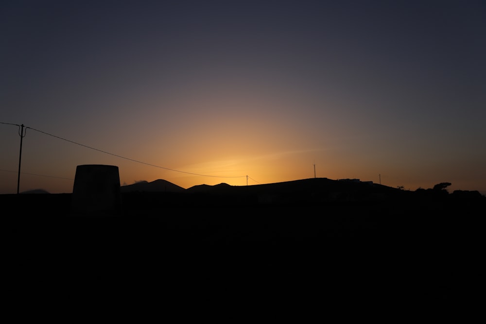 silhouette of mountain during sunset