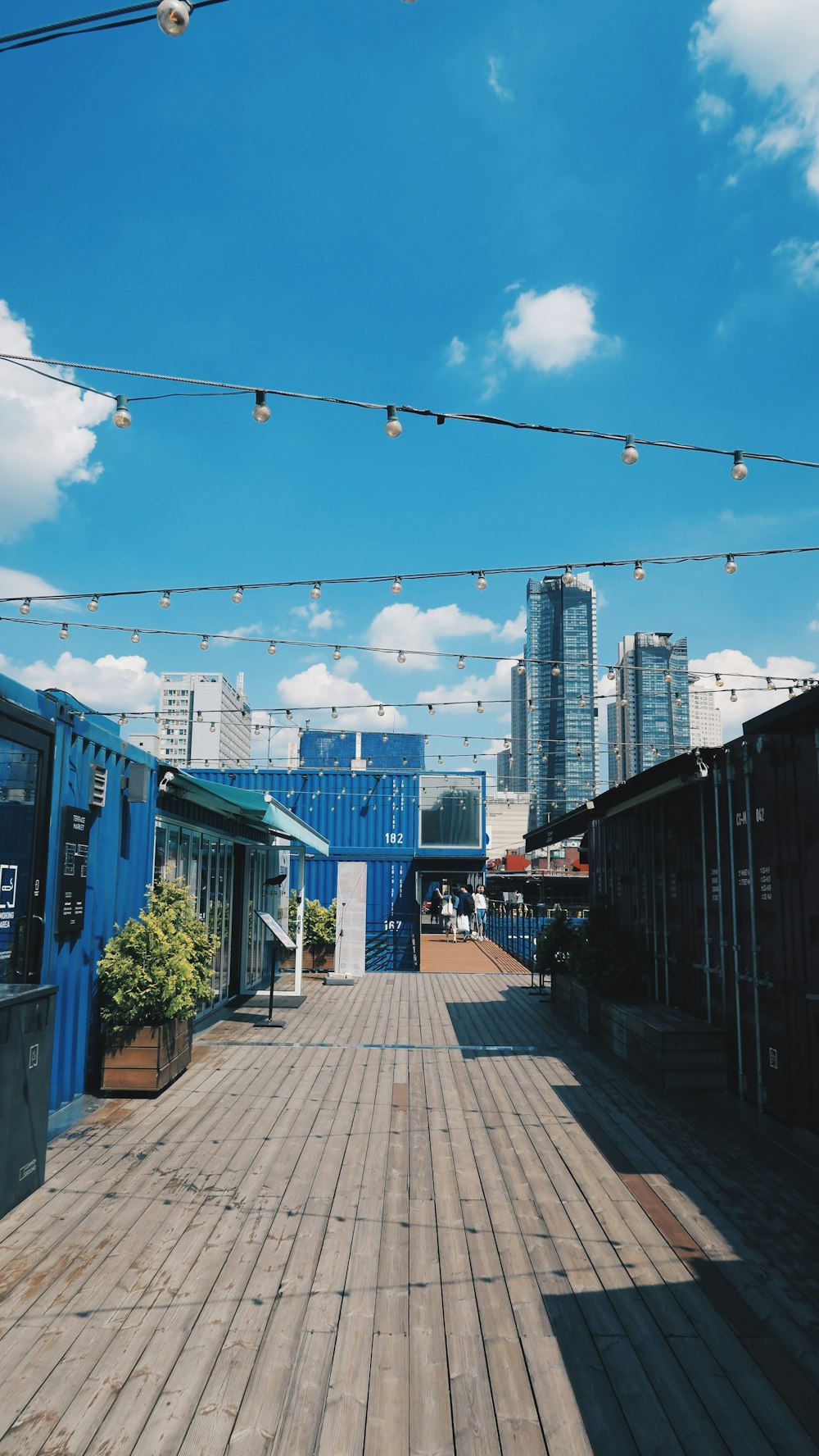 blue and white concrete building under blue sky during daytime