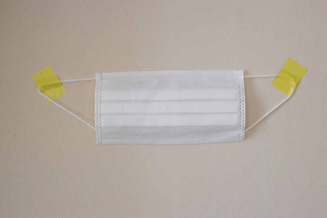 white towel on yellow clothes hanger