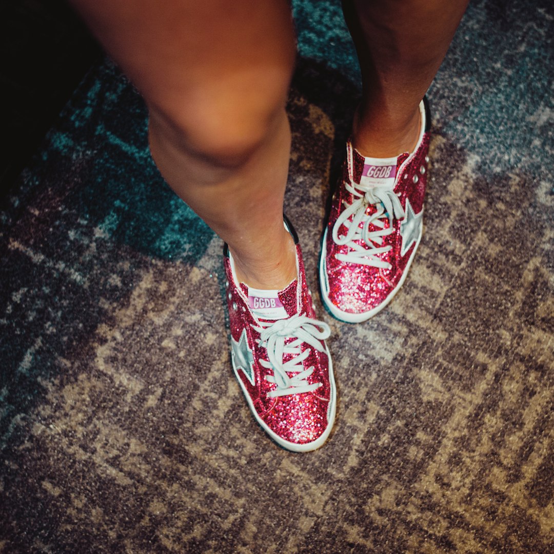 person in red and white sneakers