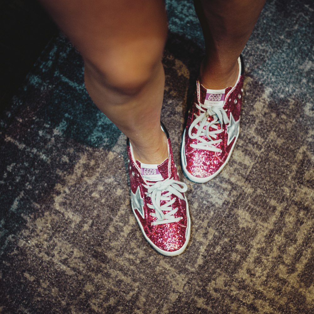 person in red and white sneakers