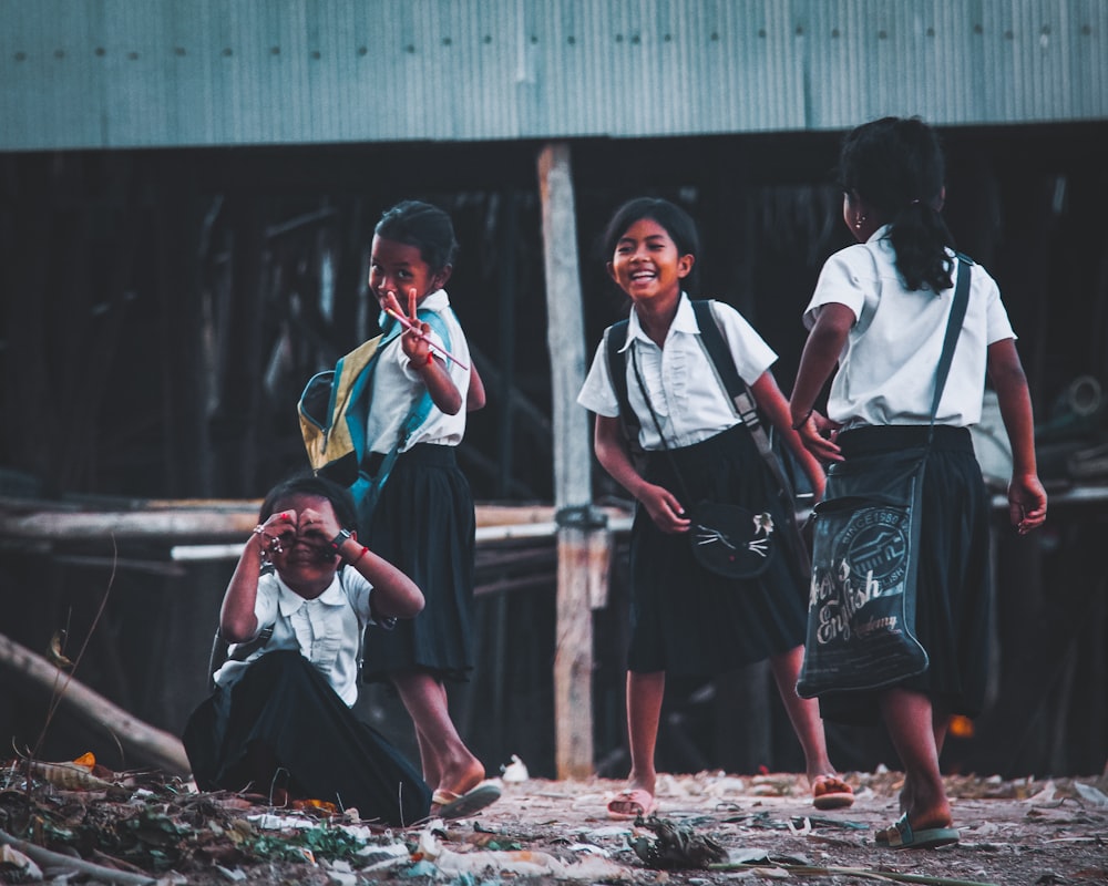 a group of young children standing next to each other