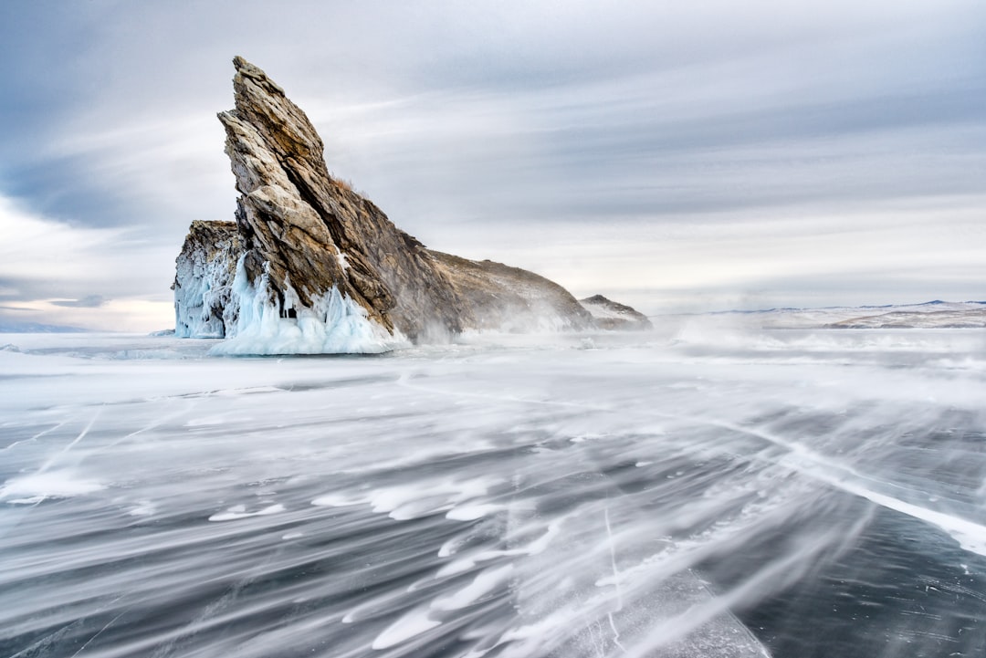 brown rock formation on white snow covered ground during daytime