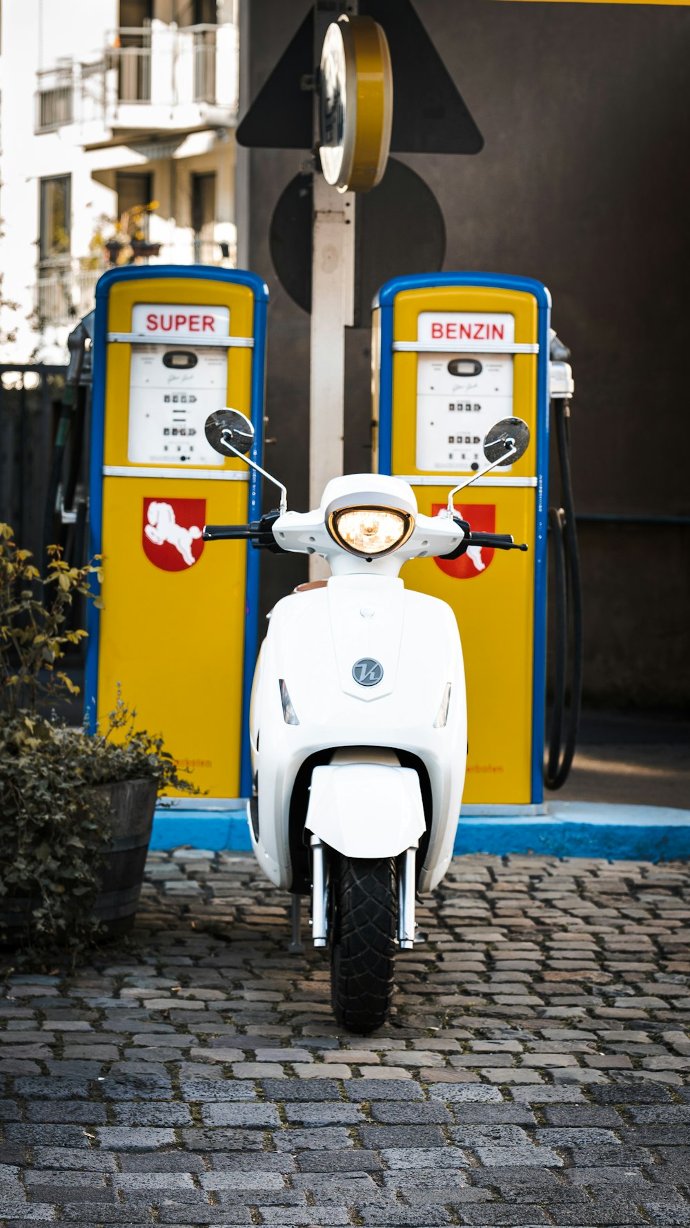 white and blue motor scooter