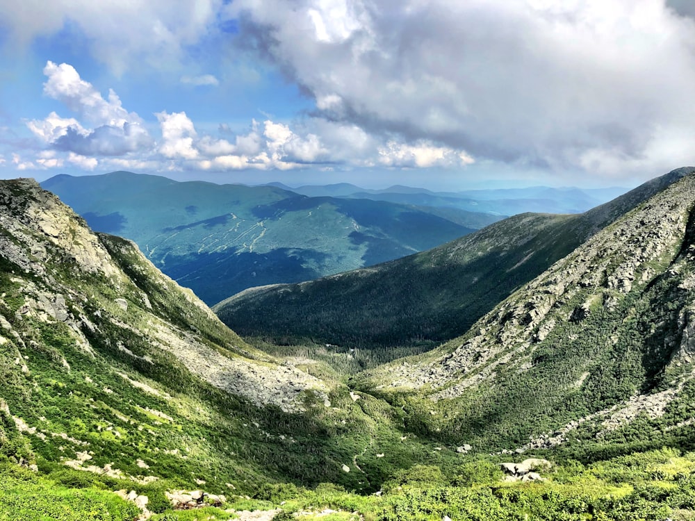 green mountains under white clouds during daytime