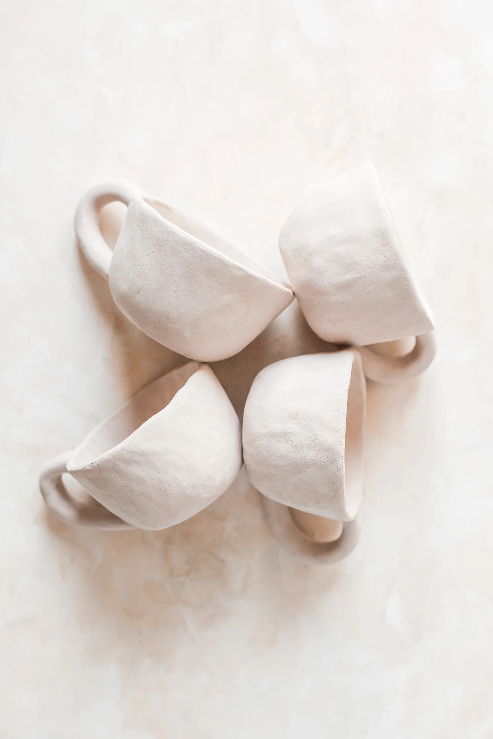 Handmade ceramic cups representing the traditional 9 year anniversary pottery gift