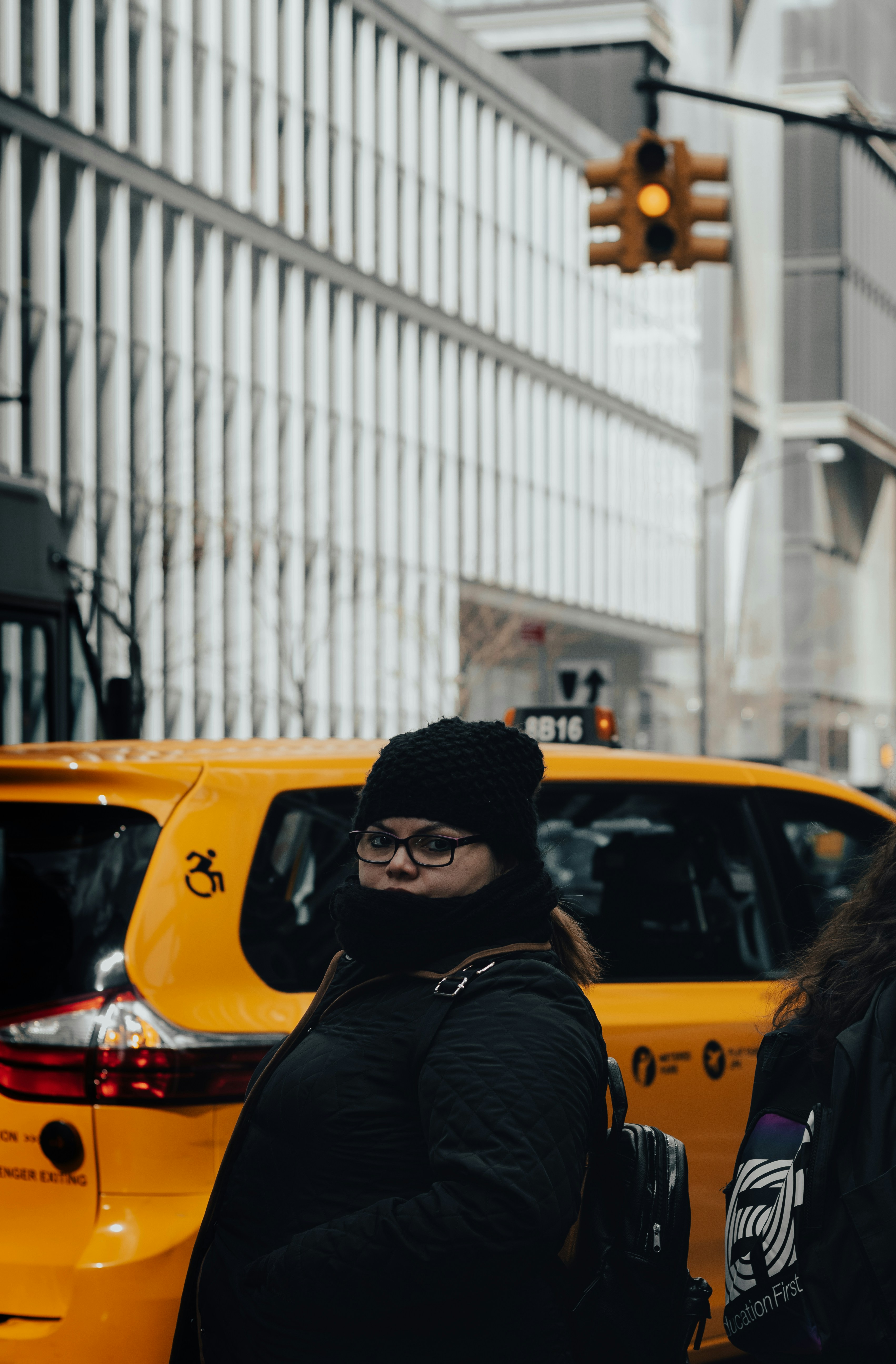 man in black jacket wearing black knit cap and black sunglasses