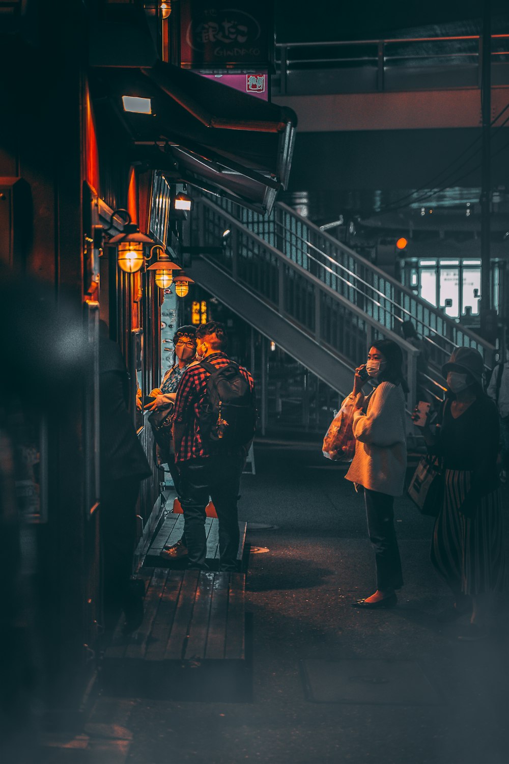 people walking on street during night time