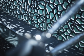 black metal fence with green light