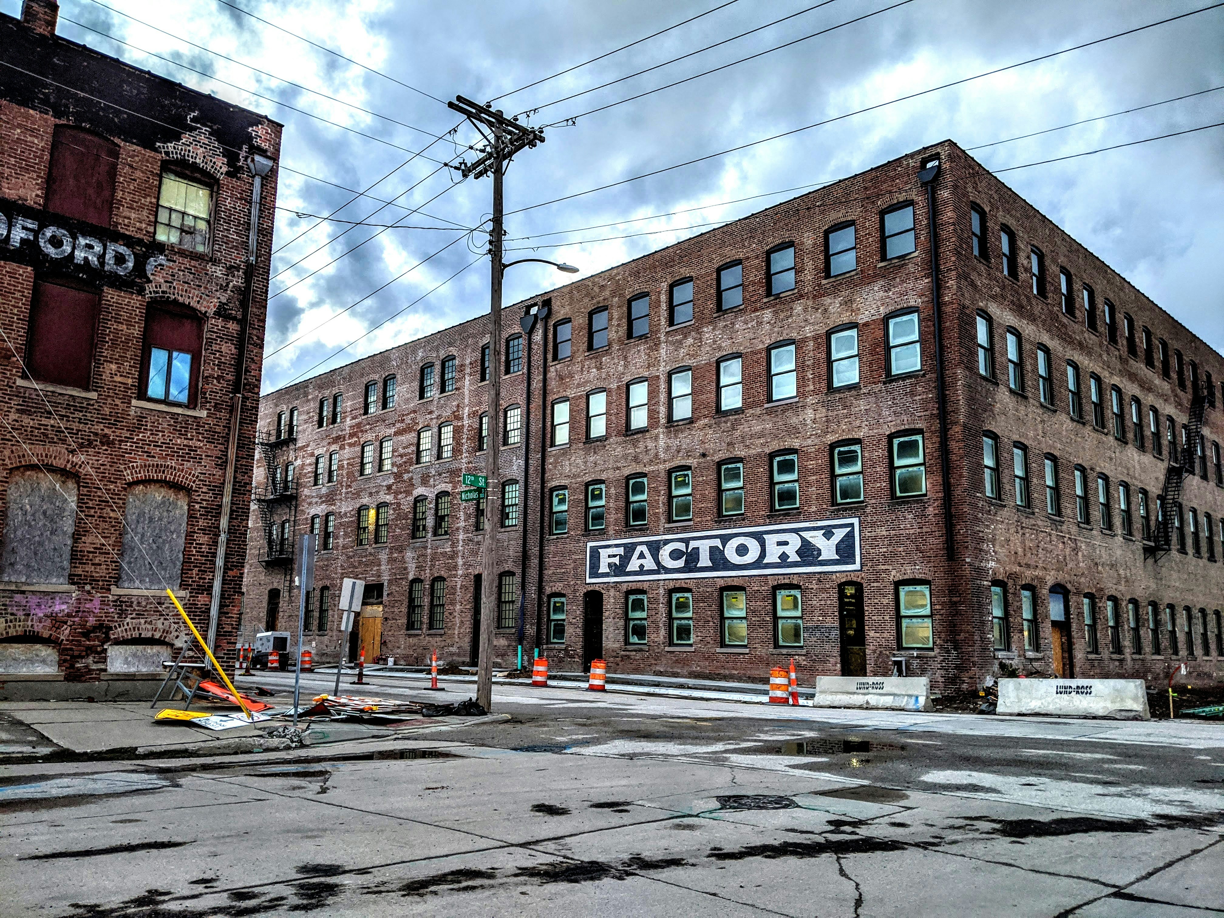brown brick building near road during daytime