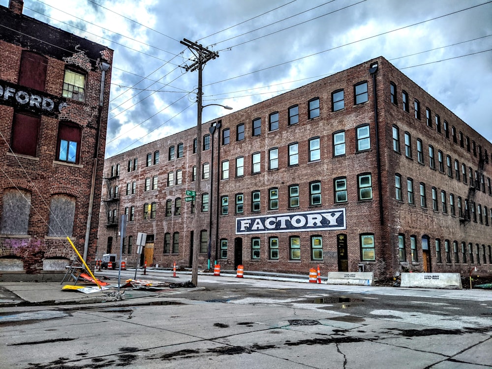 brown brick building near road during daytime