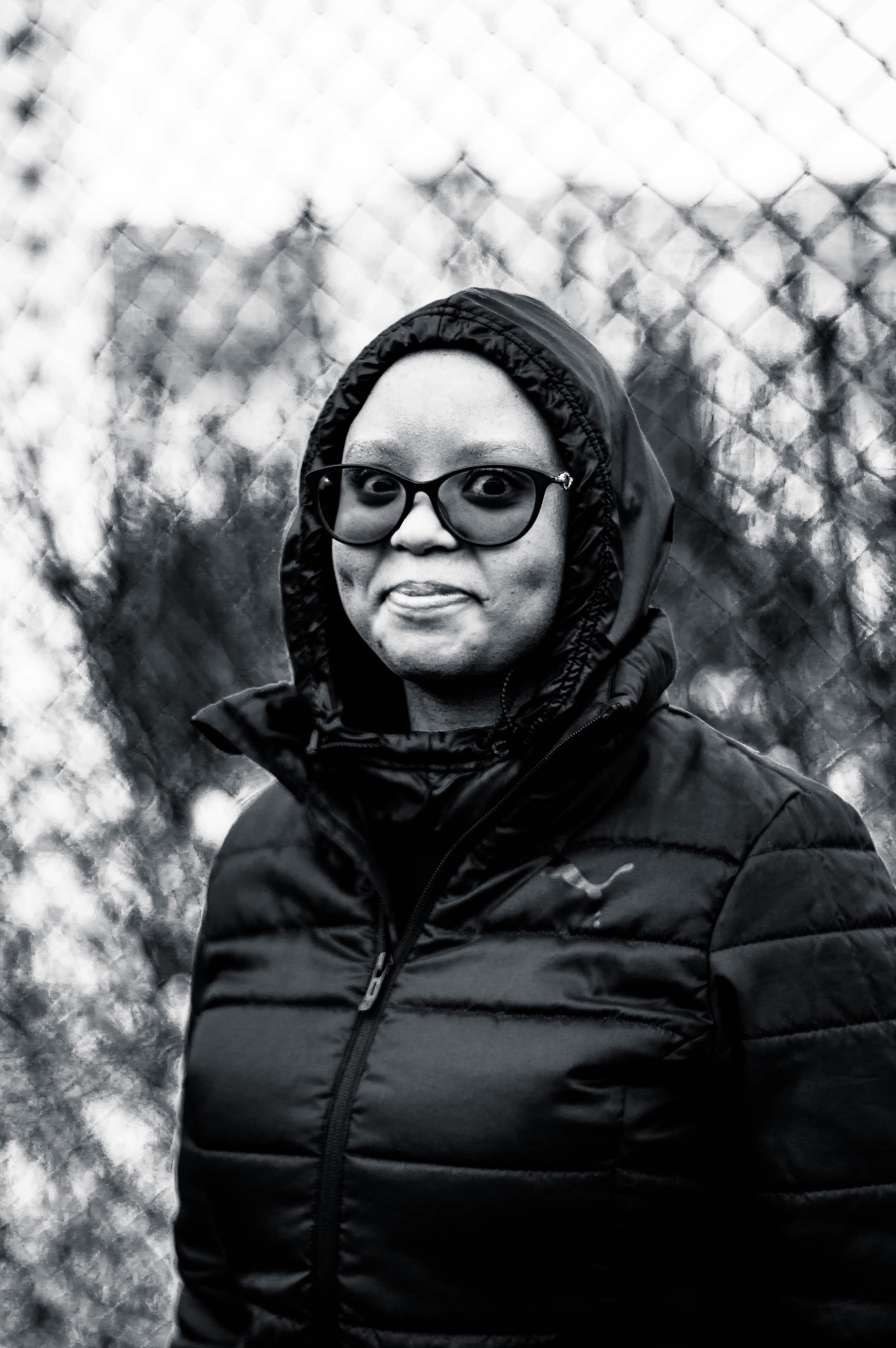 man in black hoodie wearing black framed eyeglasses