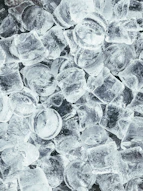 clear glass round ornament on gray stone