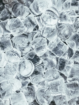 clear glass round ornament on gray stone