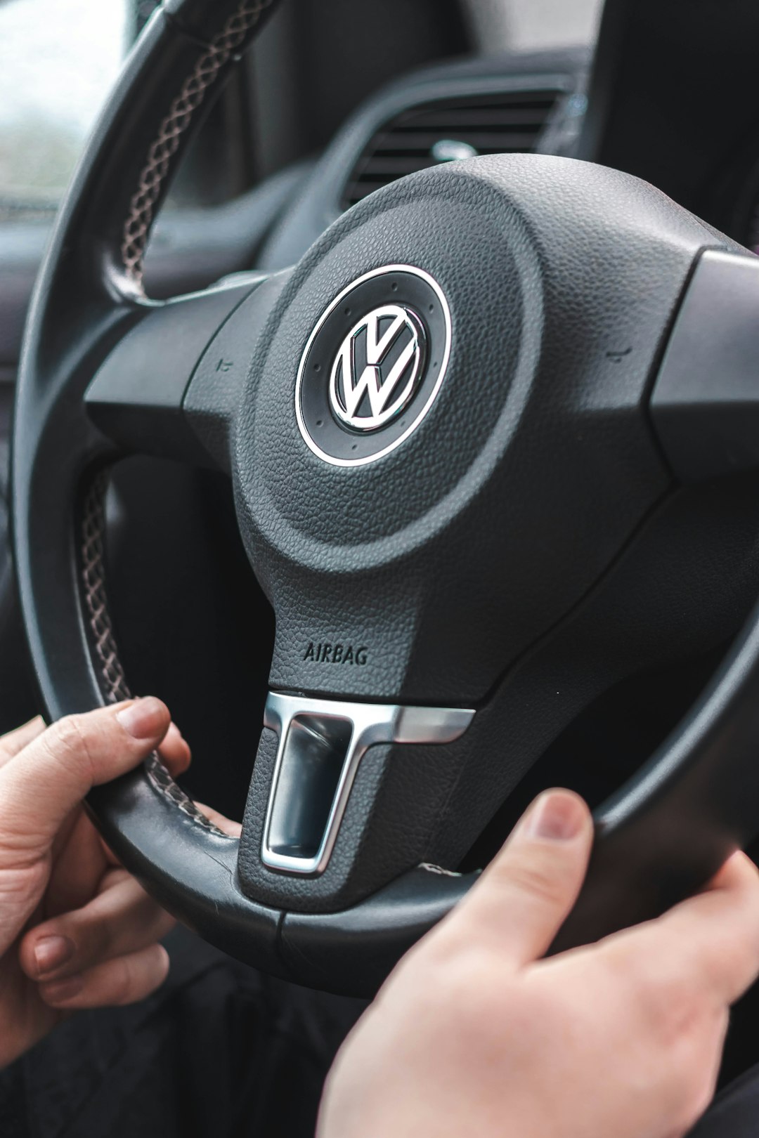 black nissan car steering wheel