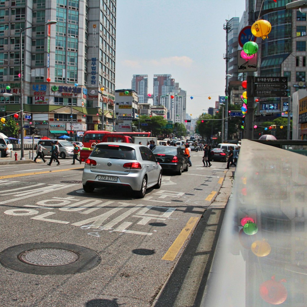 cars on road near buildings during daytime