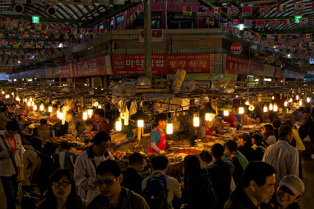 people standing in front of store during nighttime