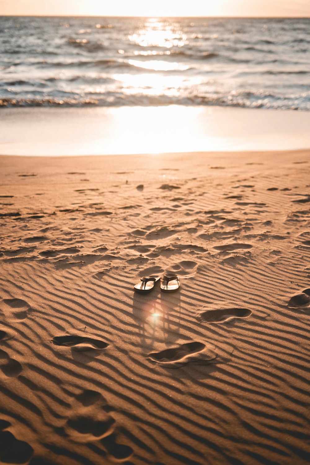 2 silver and black ring on brown sand