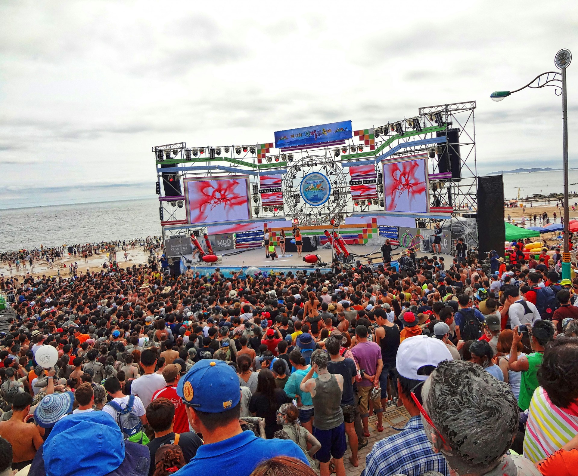 woman wearing yellow long-sleeved dress under white clouds and blue sky during daytime