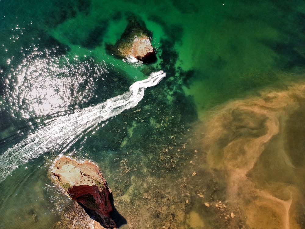 aerial view of person surfing on sea waves during daytime