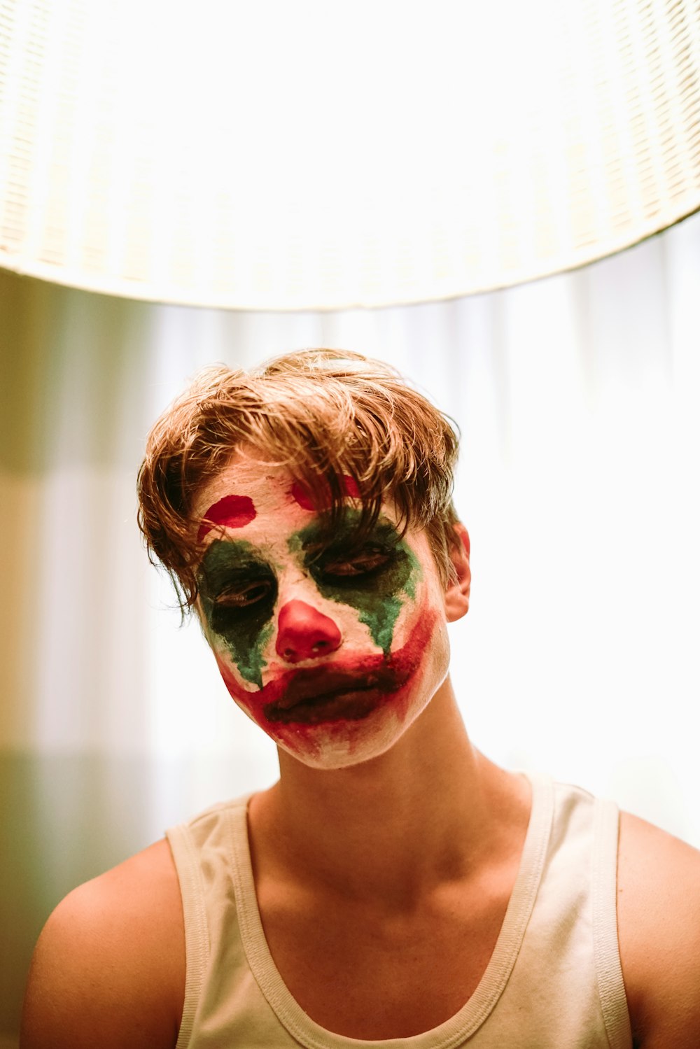 woman with red and white face paint