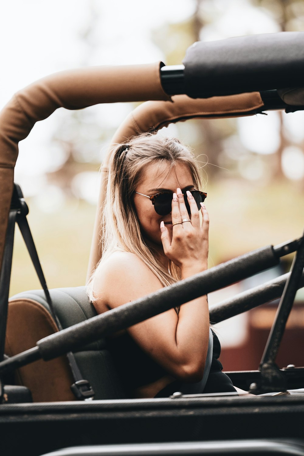 woman in black sunglasses and black tank top