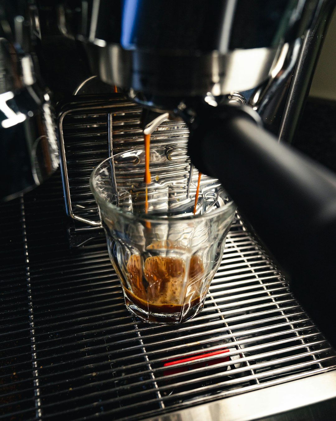 clear glass cup with brown liquid