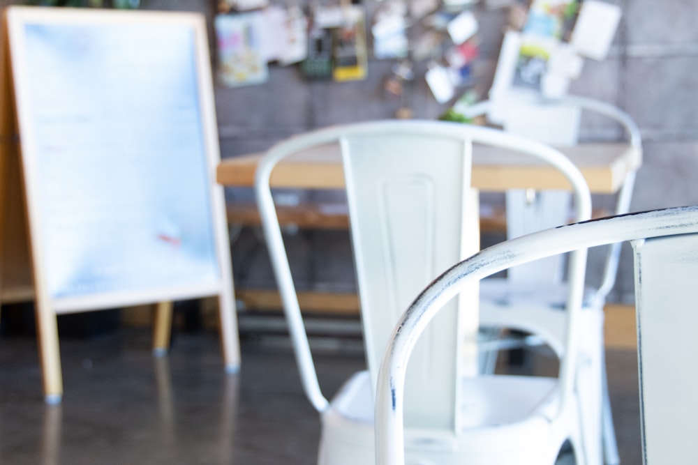 white plastic chair on brown wooden floor