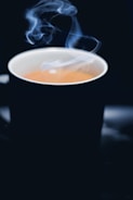 A steaming cup of freshly brewed coffee.