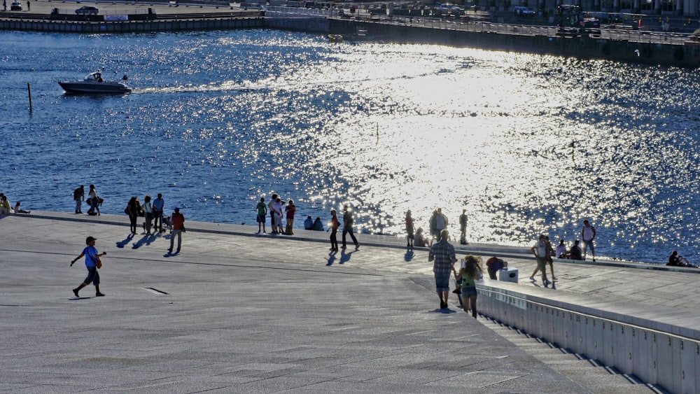 people walking on the beach during daytime